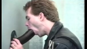 Gay glory hole cock sucking on the toilet