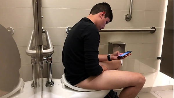 Handsome well hung guy caught jerking off in public toilets