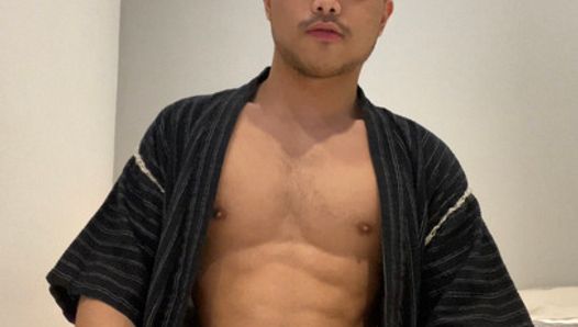 Asian boy in Jinbei stroking