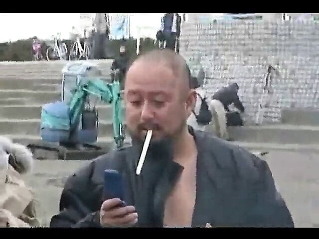 Japanese bodybuilder exhibiting at Matsuri on public beach