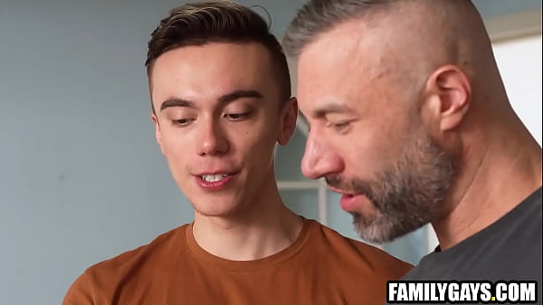 Stepfather teaching stepson boy scout skills