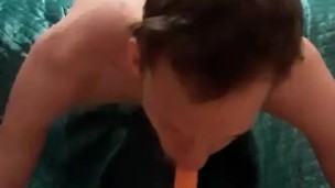 Skinny teen Deepthroating a big fat carrot while upsidedown (turn up the volume)