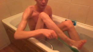 Very skinny teen scrubs and fingers his sexy ass in bathtub
