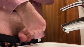 Hairy guy in suit pissing and jerking off at office toilet and cum into restroom’s sink